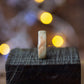 Side view of Maple Wood Ring with Stainless Steel Core by Andrwood, highlighting smooth edges and unique wood grain pattern.